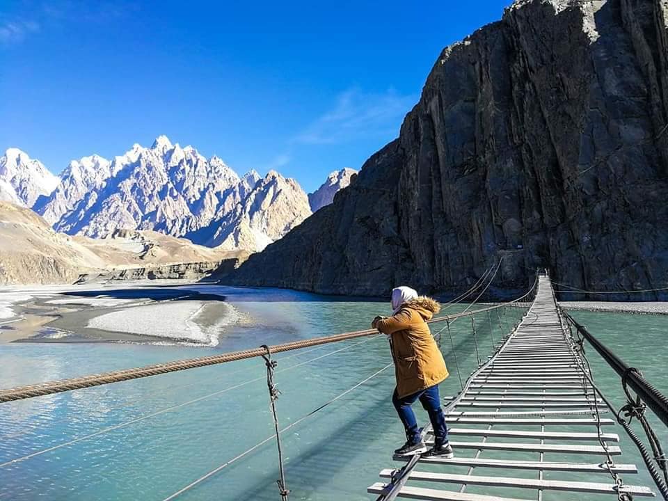 Hussaini Suspension Bridge crossing Hunza river with spaced planks