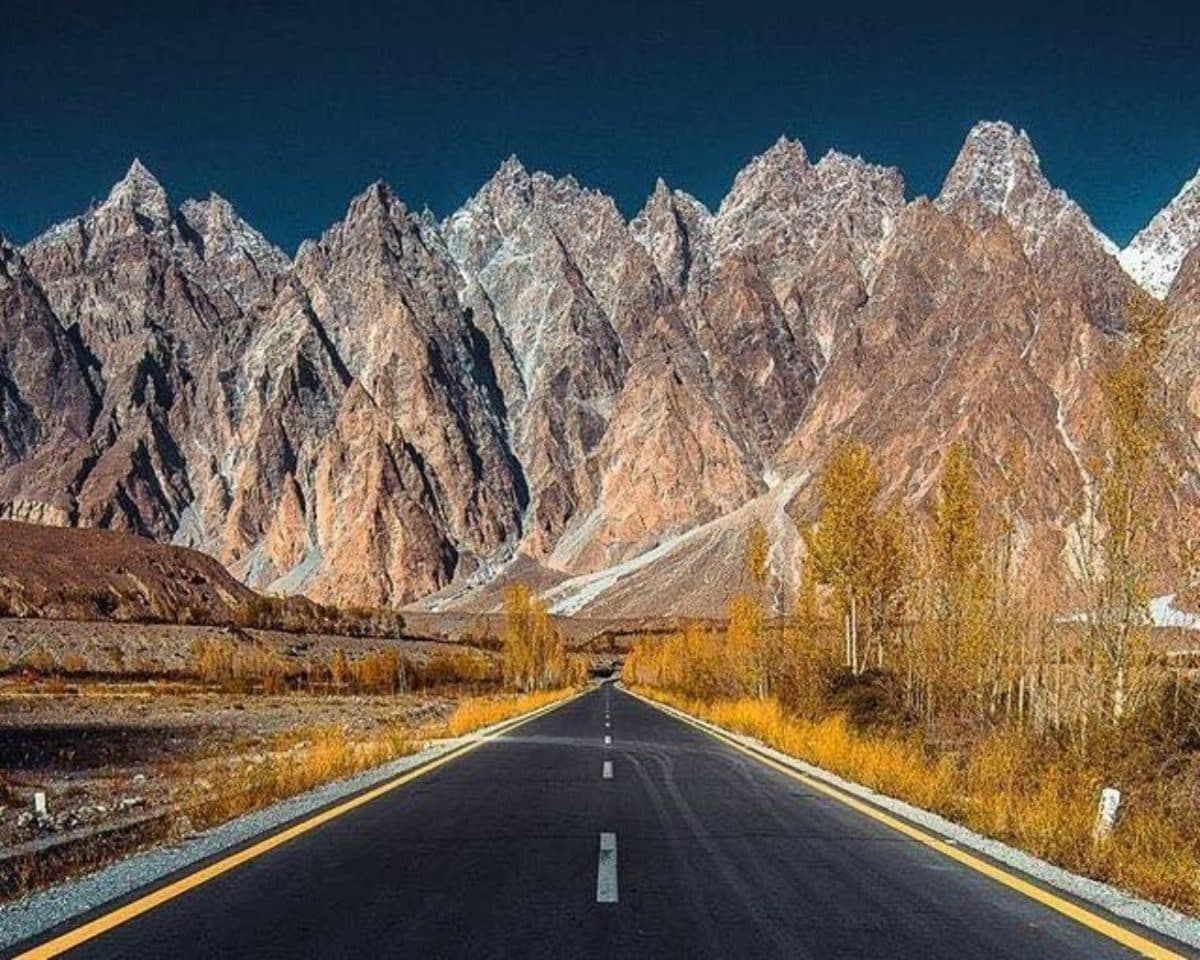 Jagged Passu Cones rising like cathedrals against clear blue sky