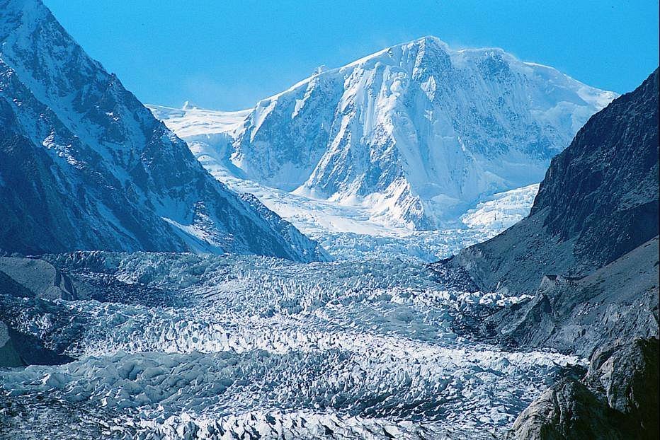 Passu Glacier blue ice seracs and mountain moraine