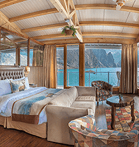Presidential Suite bedroom with panoramic lake balcony and plush king bed