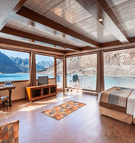Royal Suite interior showing private Jacuzzi and king bed overlooking Attabad Lake