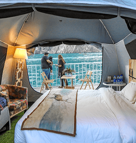 Luxury Glamping Tent situated on the grassy shore of Attabad Lake