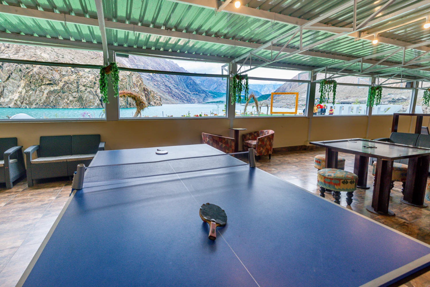 Munch and Play Gaming Lounge with snooker table, gaming consoles, and coffee counter
