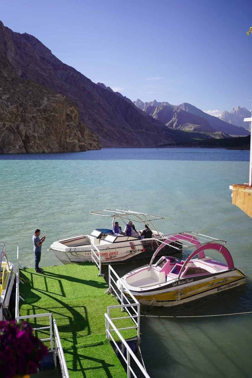 Speedboat and jet ski water sports on turquoise Attabad Lake from Luxus Hunza dock